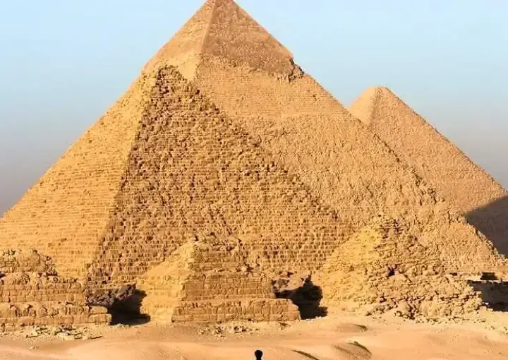 tourist standing near great pyramids giza